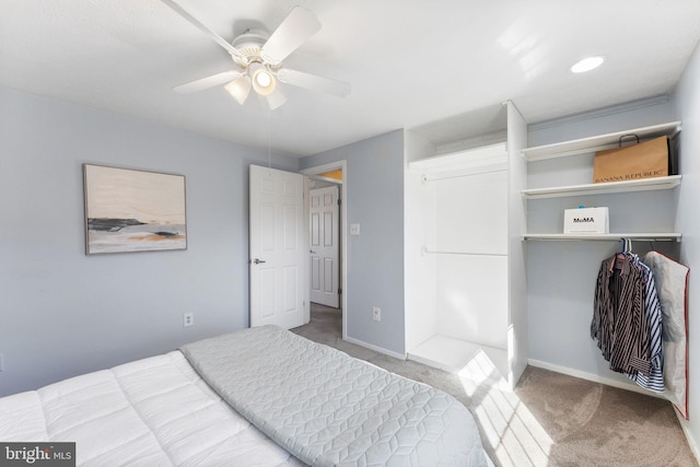 bedroom featuring baseboards, carpet floors, a closet, and ceiling fan