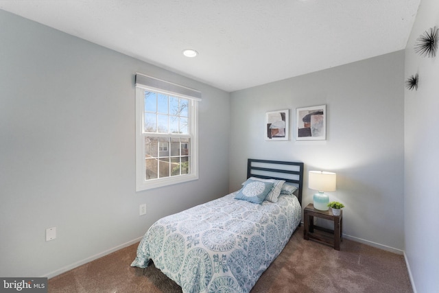 bedroom featuring carpet and baseboards