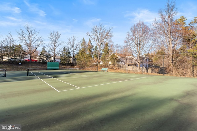 view of sport court with fence