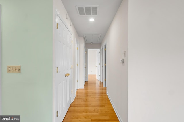 corridor featuring light hardwood / wood-style floors