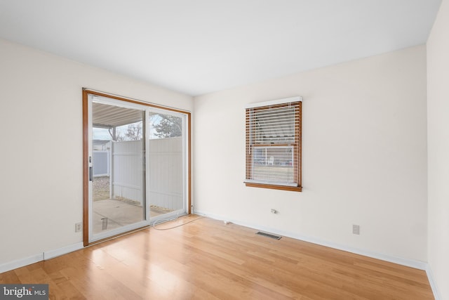 empty room featuring hardwood / wood-style flooring