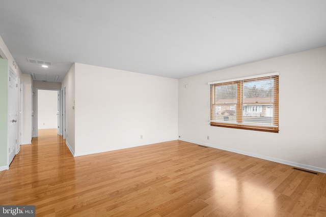 unfurnished room featuring light hardwood / wood-style floors