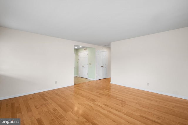 spare room featuring light hardwood / wood-style floors