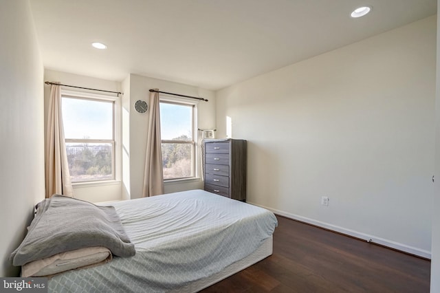 bedroom featuring dark hardwood / wood-style flooring