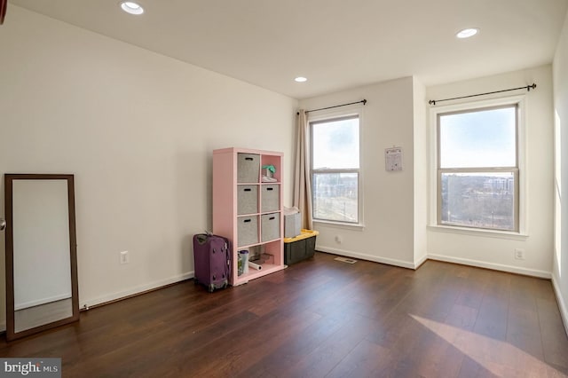 interior space with dark hardwood / wood-style flooring