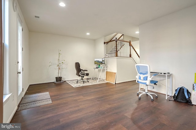 office featuring dark hardwood / wood-style flooring and a healthy amount of sunlight