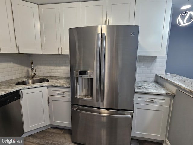 kitchen with white cabinetry, sink, and stainless steel appliances