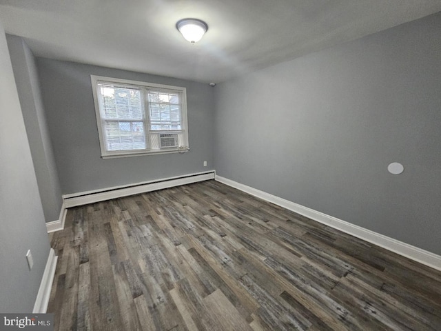 empty room featuring a baseboard radiator, cooling unit, and dark hardwood / wood-style flooring