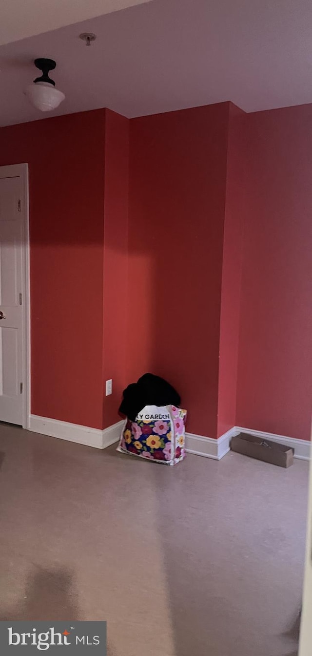 spare room featuring concrete flooring