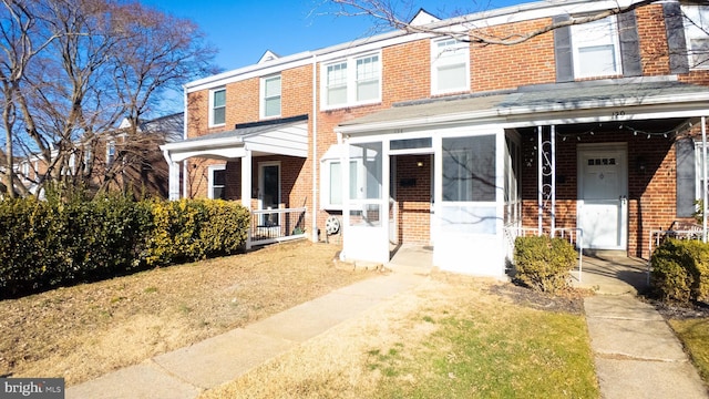 view of property with brick siding