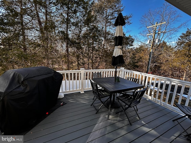 wooden deck featuring grilling area