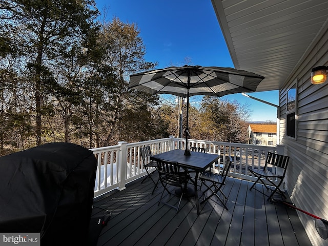 wooden deck featuring grilling area