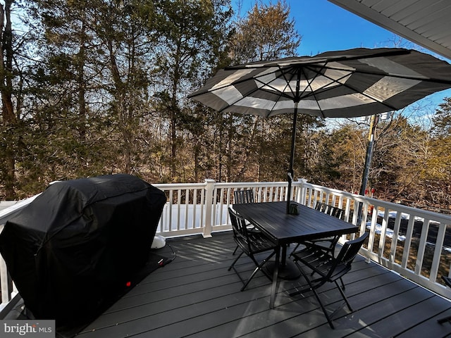 wooden deck featuring area for grilling