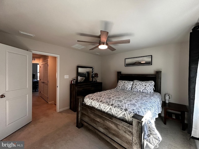 bedroom featuring light carpet and ceiling fan