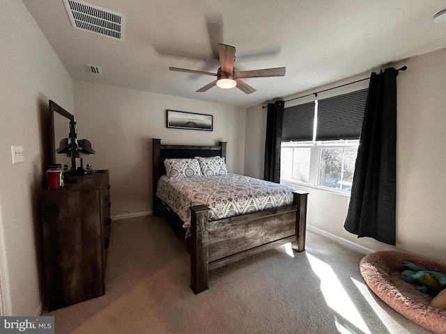 bedroom with ceiling fan and carpet flooring