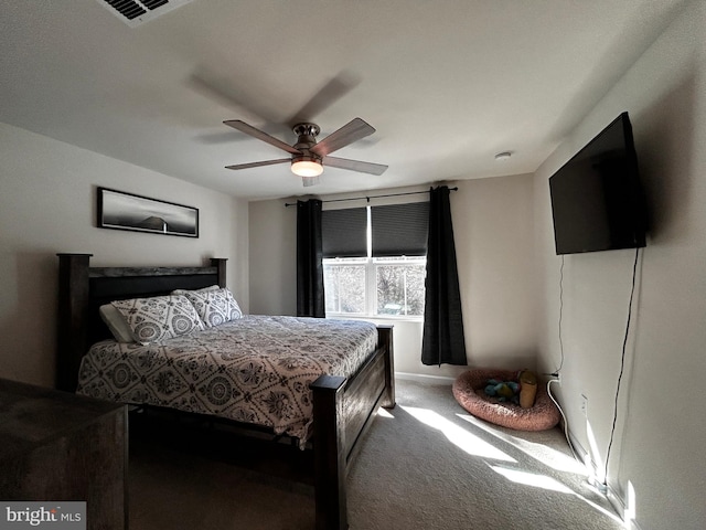 bedroom featuring ceiling fan and carpet