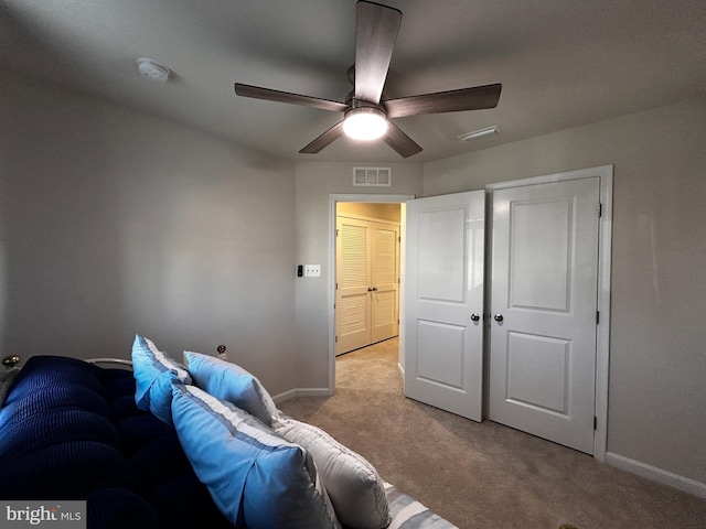 interior space with ceiling fan