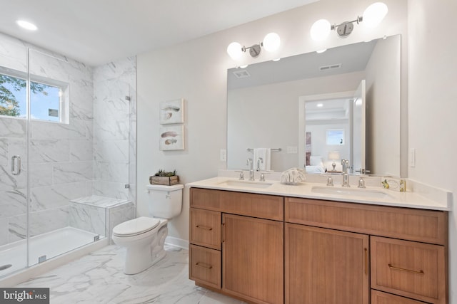 bathroom featuring vanity, toilet, and walk in shower