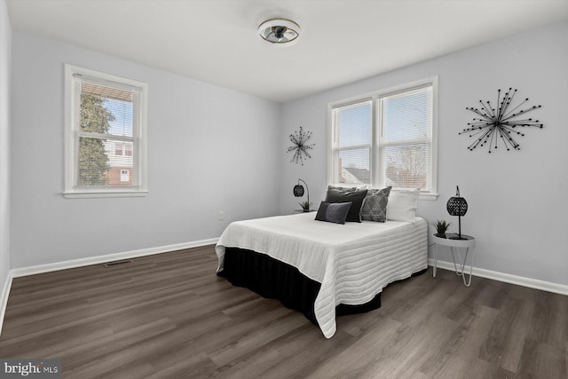 bedroom featuring dark wood-type flooring