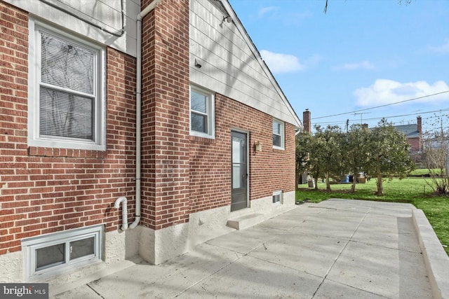 view of property exterior featuring a patio area