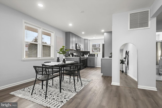 dining space featuring dark wood-type flooring