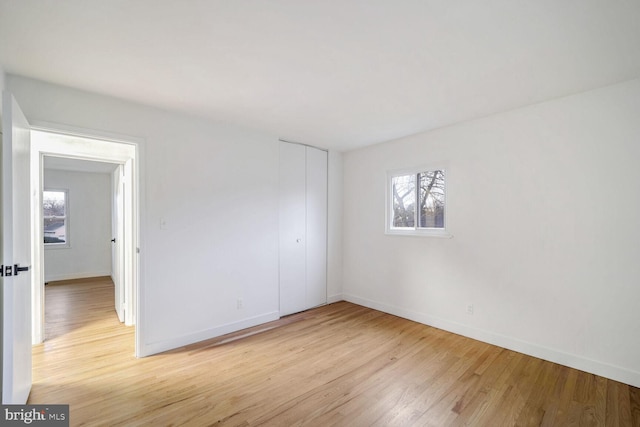 spare room featuring light hardwood / wood-style flooring