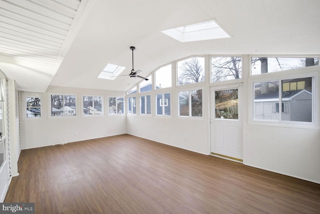 unfurnished sunroom with ceiling fan and vaulted ceiling with skylight