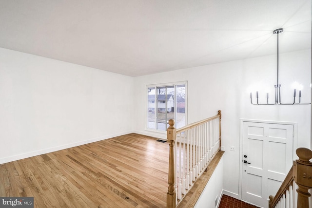 staircase featuring hardwood / wood-style flooring