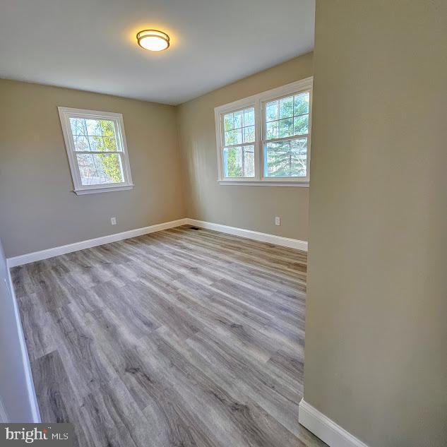 unfurnished room featuring light hardwood / wood-style flooring