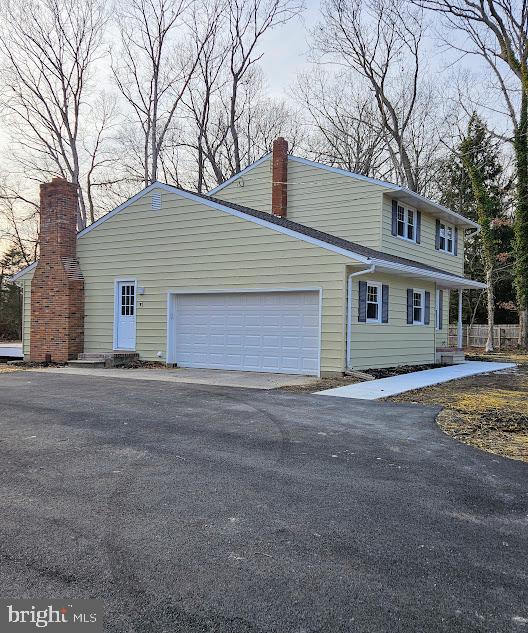 view of side of home with a garage