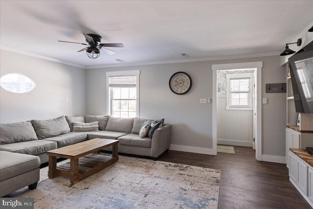 living room with hardwood / wood-style flooring, ceiling fan, a healthy amount of sunlight, and crown molding