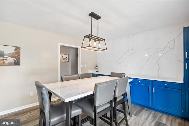 dining area featuring wood-type flooring