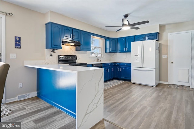 kitchen featuring black / electric stove, white refrigerator with ice dispenser, kitchen peninsula, and blue cabinets