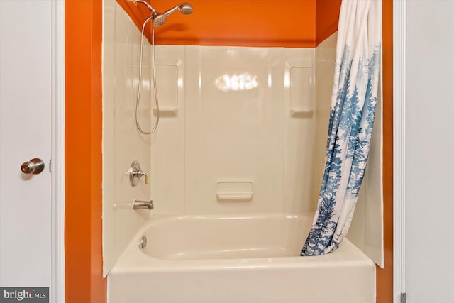 bathroom featuring shower / bathtub combination with curtain