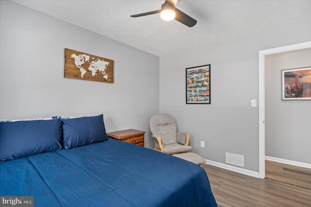 bedroom featuring ceiling fan and wood-type flooring