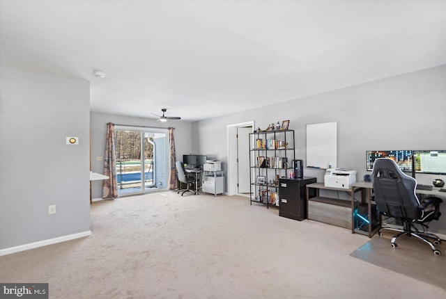 carpeted home office with ceiling fan