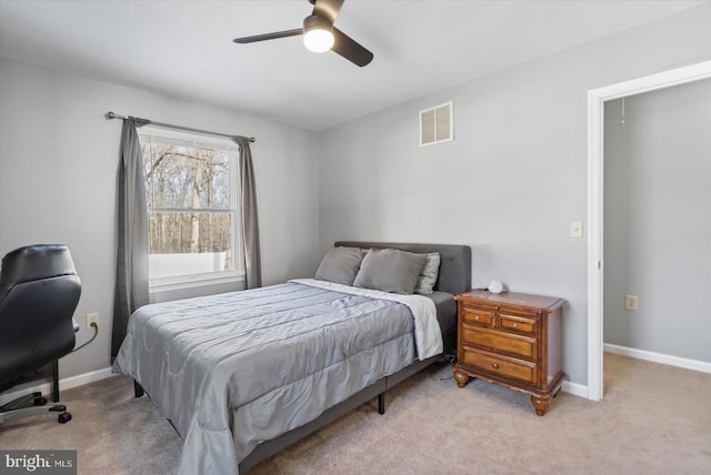 bedroom with light colored carpet and ceiling fan