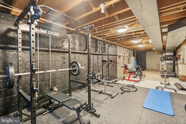 exercise room featuring gas water heater