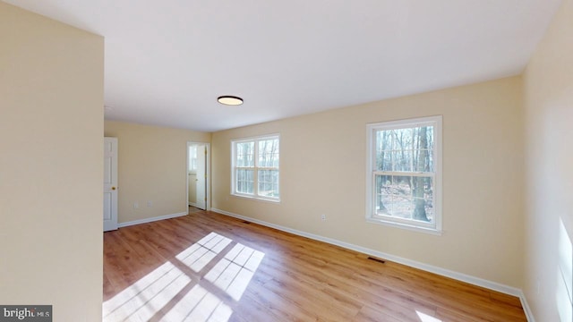 empty room with light wood-type flooring