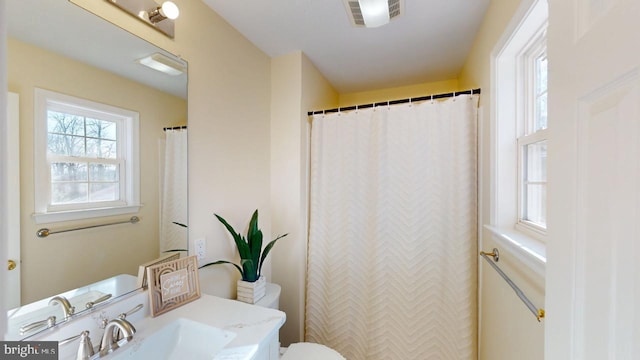 bathroom with vanity and toilet