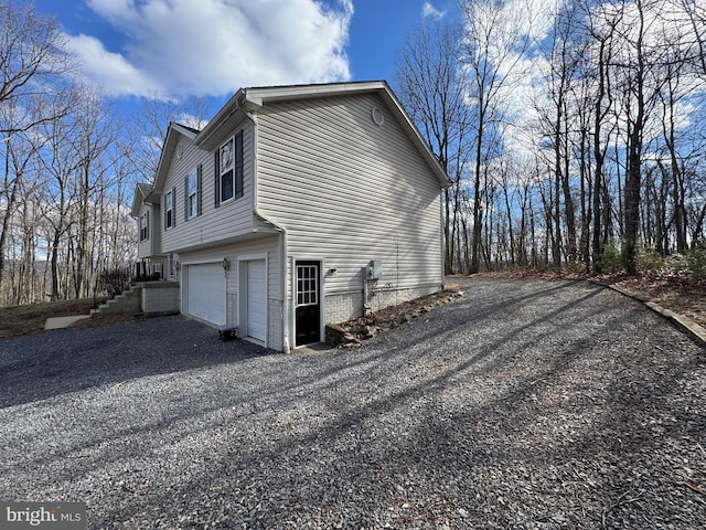 view of side of property featuring a garage