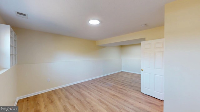 unfurnished room with light hardwood / wood-style floors