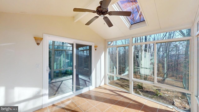 unfurnished sunroom featuring vaulted ceiling with beams and ceiling fan