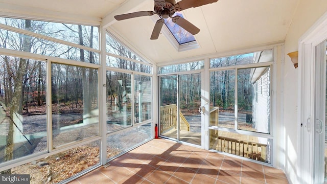 unfurnished sunroom featuring plenty of natural light, lofted ceiling with beams, and ceiling fan