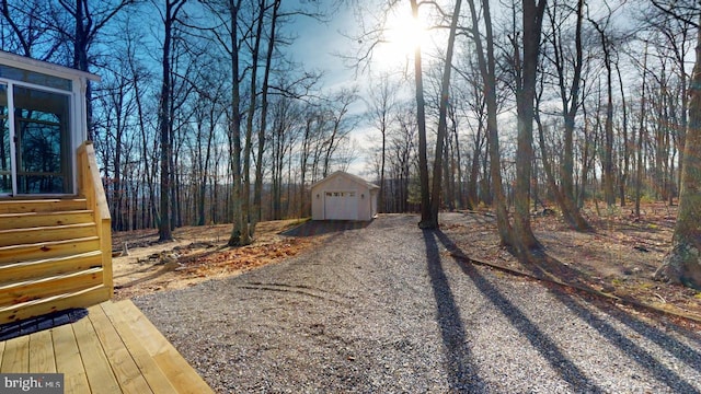 view of yard with an outbuilding and a garage