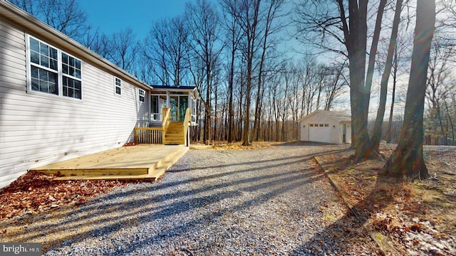 view of yard with an outbuilding and a garage