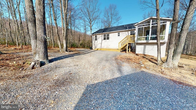 view of front of house featuring a sunroom