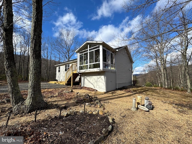 exterior space featuring a sunroom