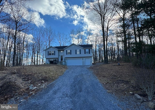 split foyer home featuring a garage