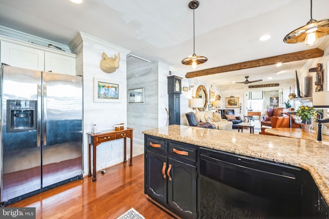 kitchen with hardwood / wood-style floors, dishwasher, pendant lighting, and stainless steel fridge